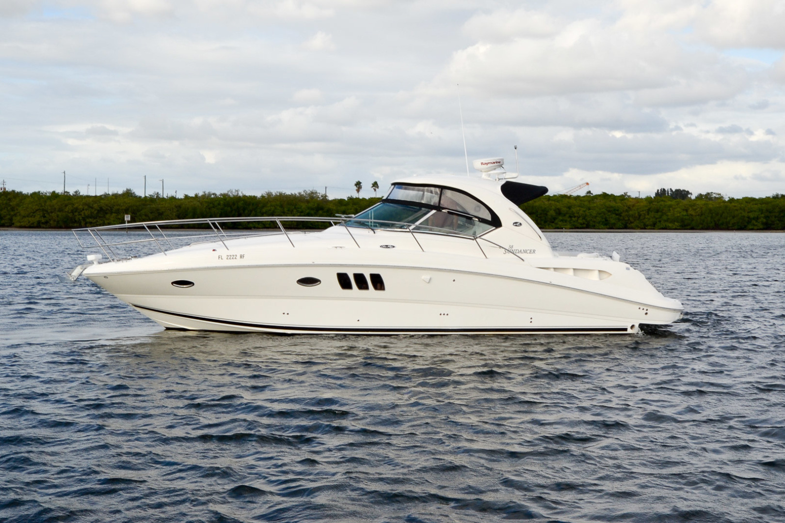A luxury pontoon boat ready for charter on the lake